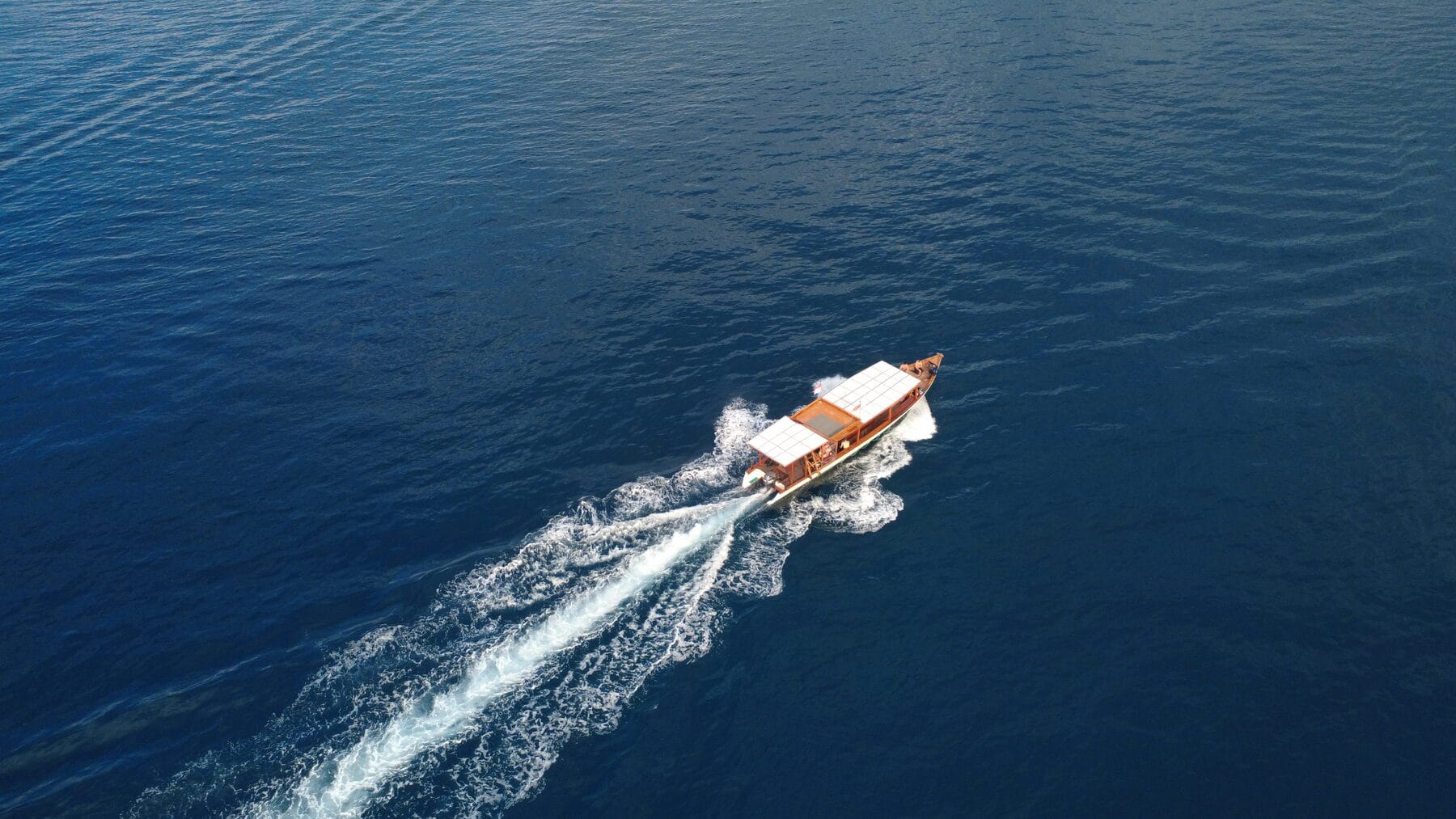 The Moana boat Martina from above, cutting across deep blue water